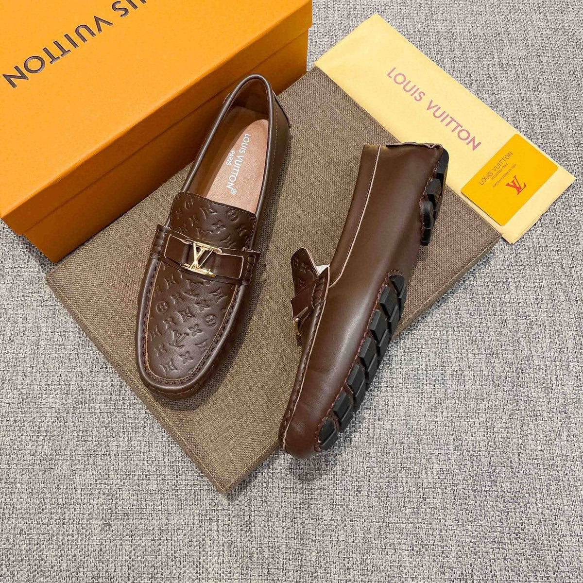 Louis Vuitton Brown Embossed Hardware Loafers — front