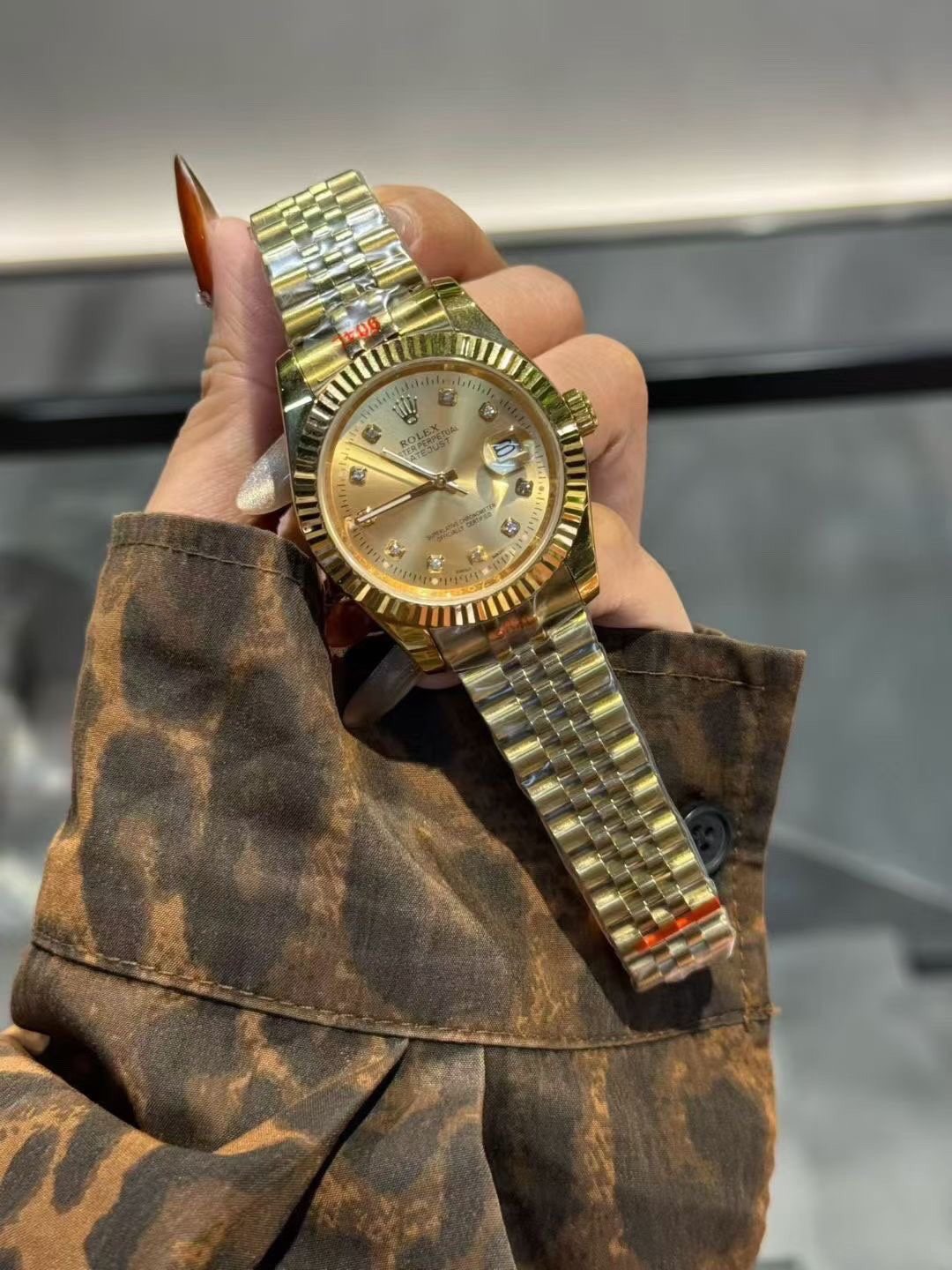 Rolex Gold-Tone Champagne Dial Watch — model