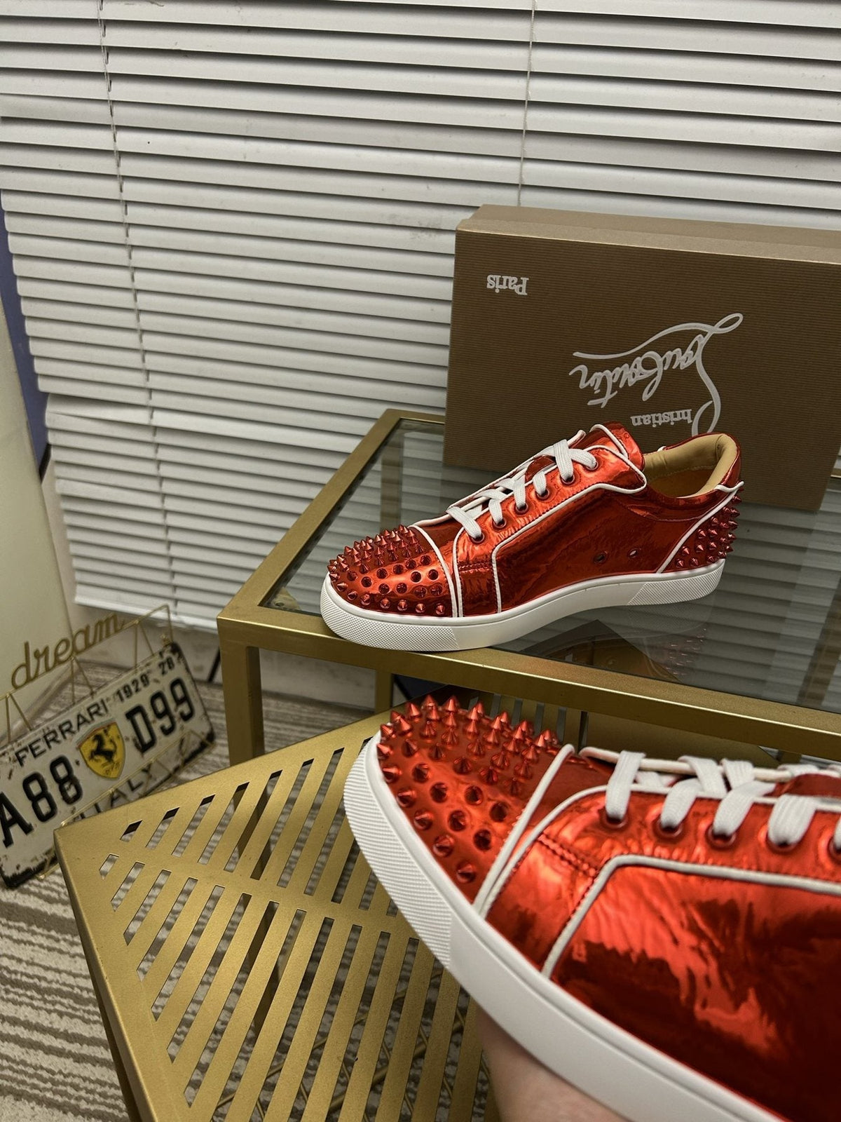 Christian Louboutin Metallic Red Studded Sneakers — detail
