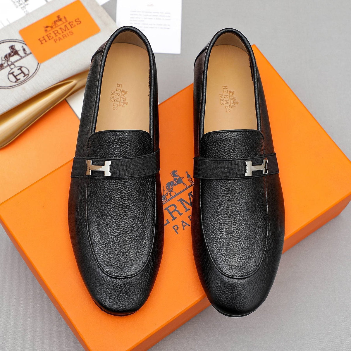 Hermès Black Pebbled Leather H-Hardware Loafers — front