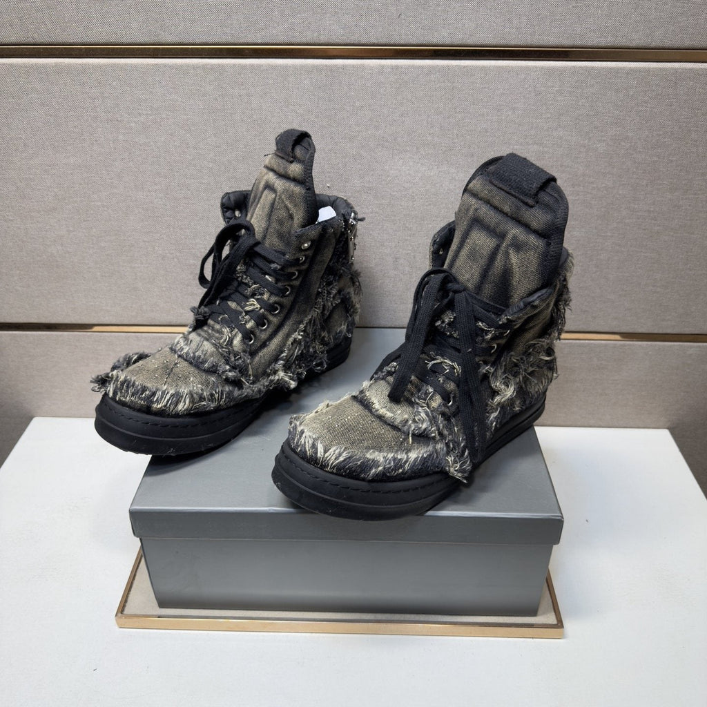 Gray and Black Distressed High-Top Sneakers — model