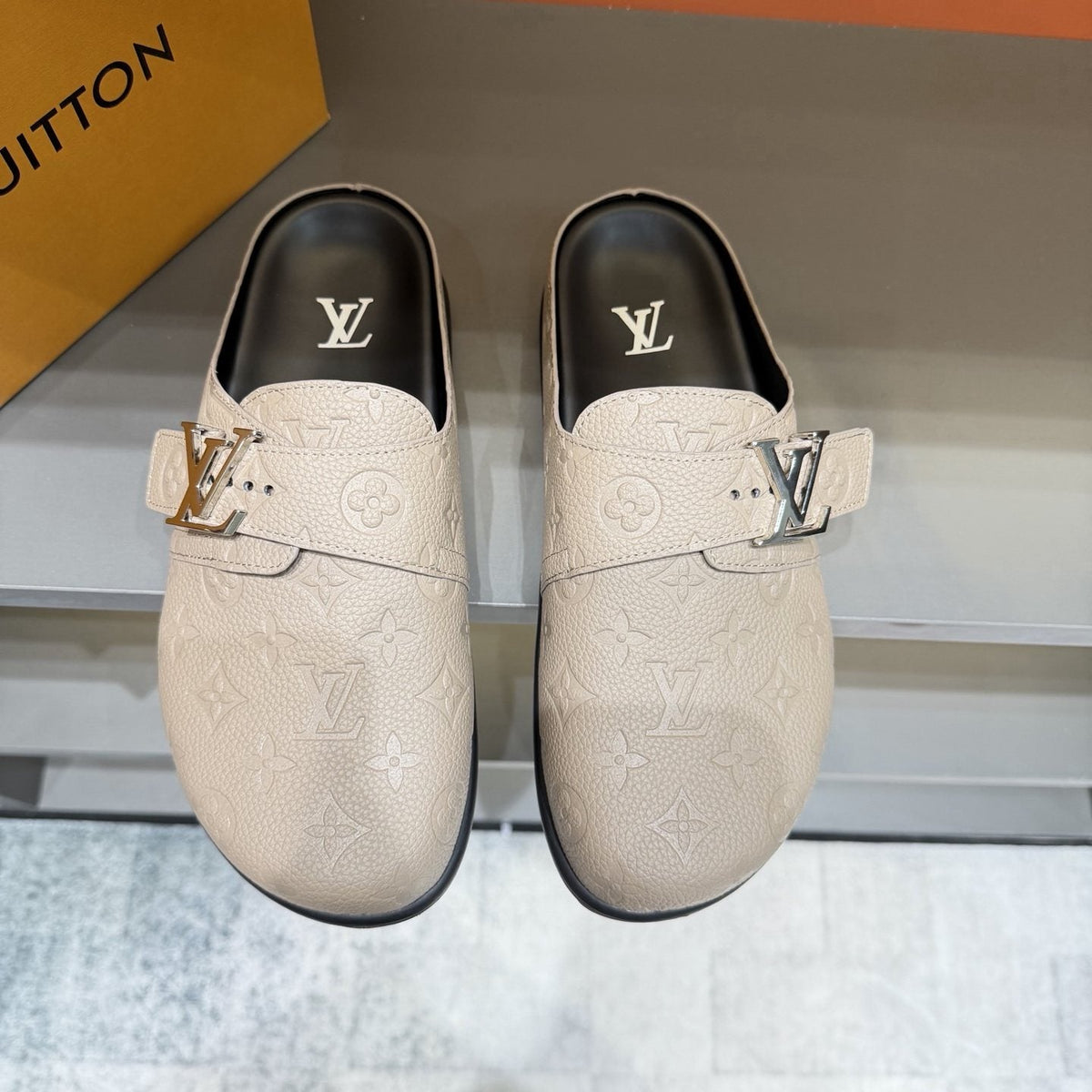 Louis Vuitton Embossed Buckle Slide Sandals — hero