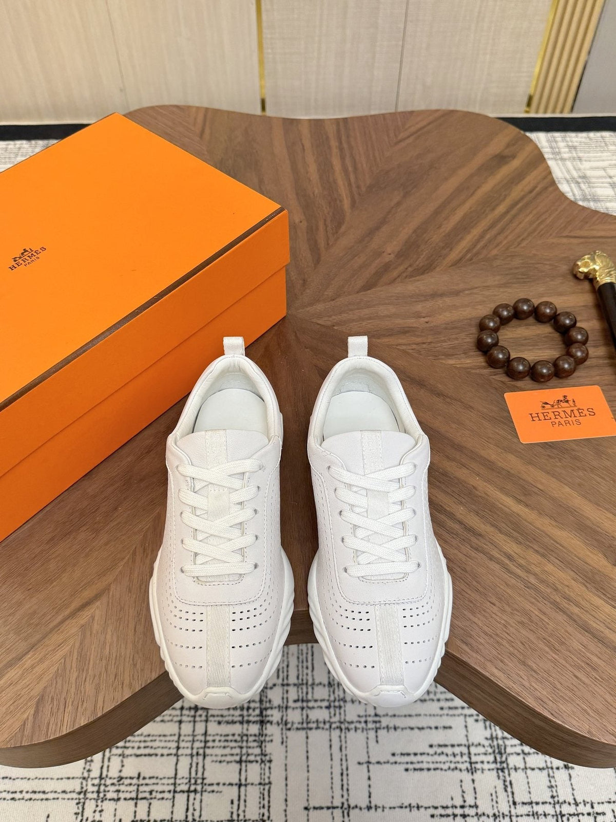 Hermès Perforated Low-Top Sneakers — front