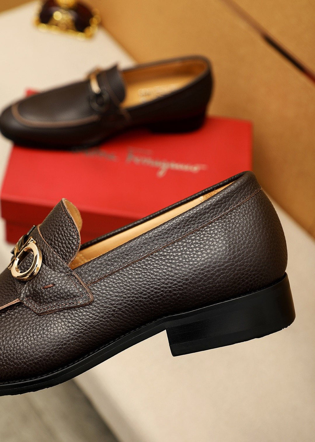 Ferragamo Pebble Leather Buckle Loafers — model