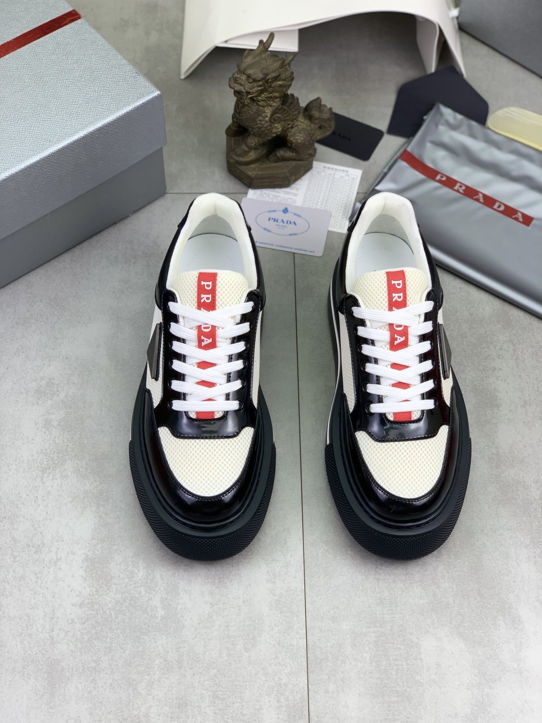 Prada Triangle Patch Low-Top Sneakers — front
