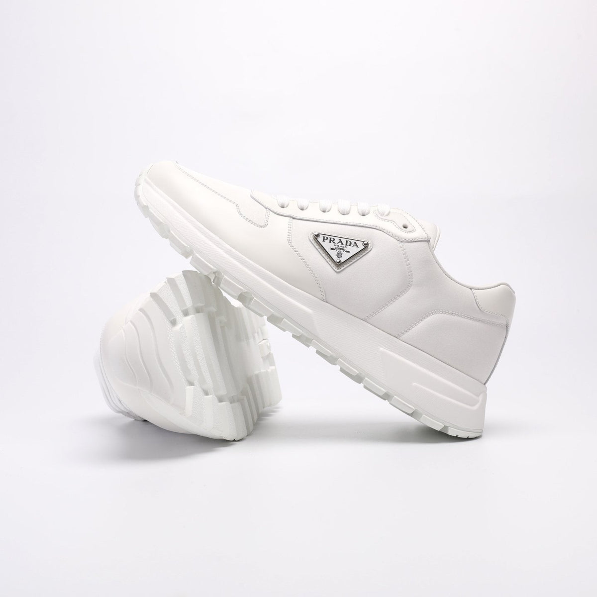 Prada Triangle Plaque Low-Top Sneakers — front