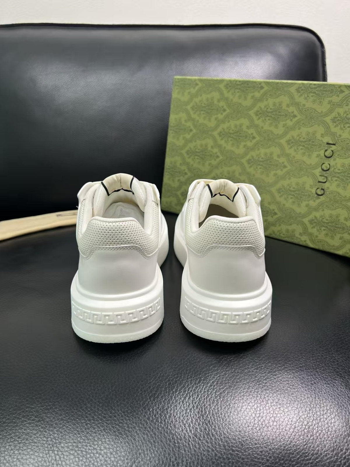 Gucci Embossed Low-Top Sneakers — detail