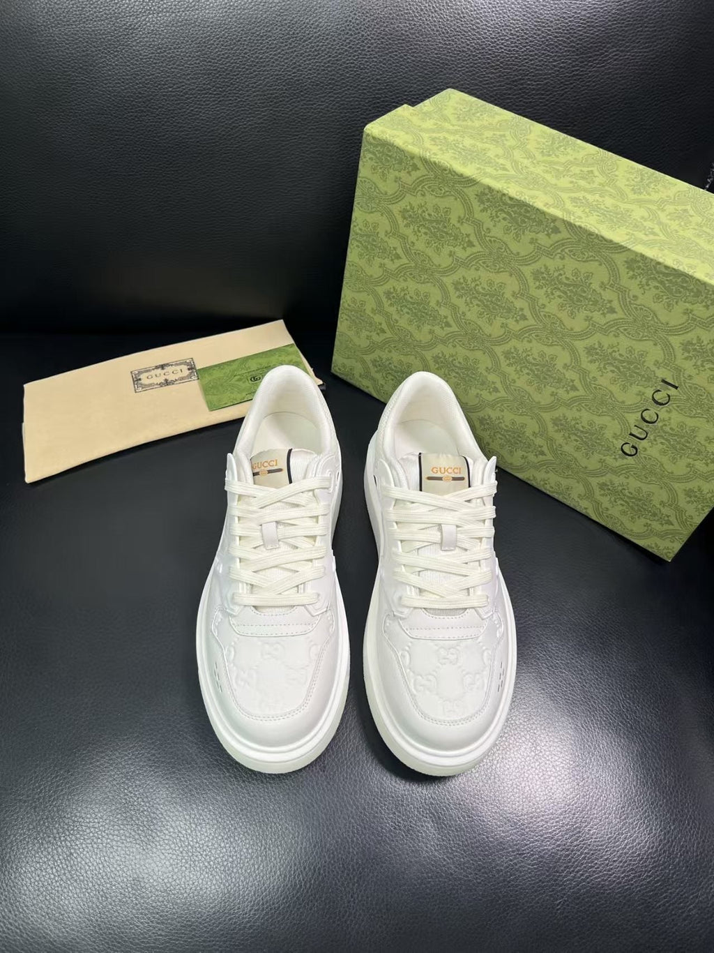 Gucci Embossed Low-Top Sneakers — front