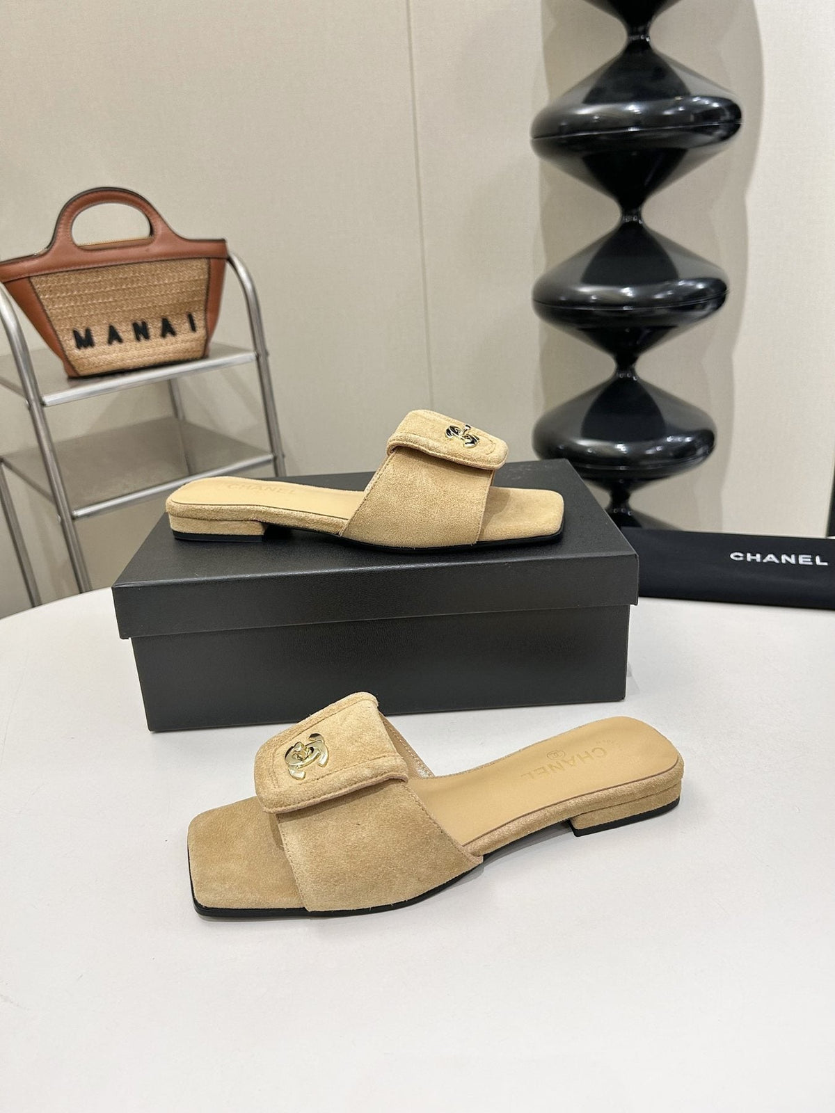 Chanel Square-Toe Emblem Slide Sandals — model